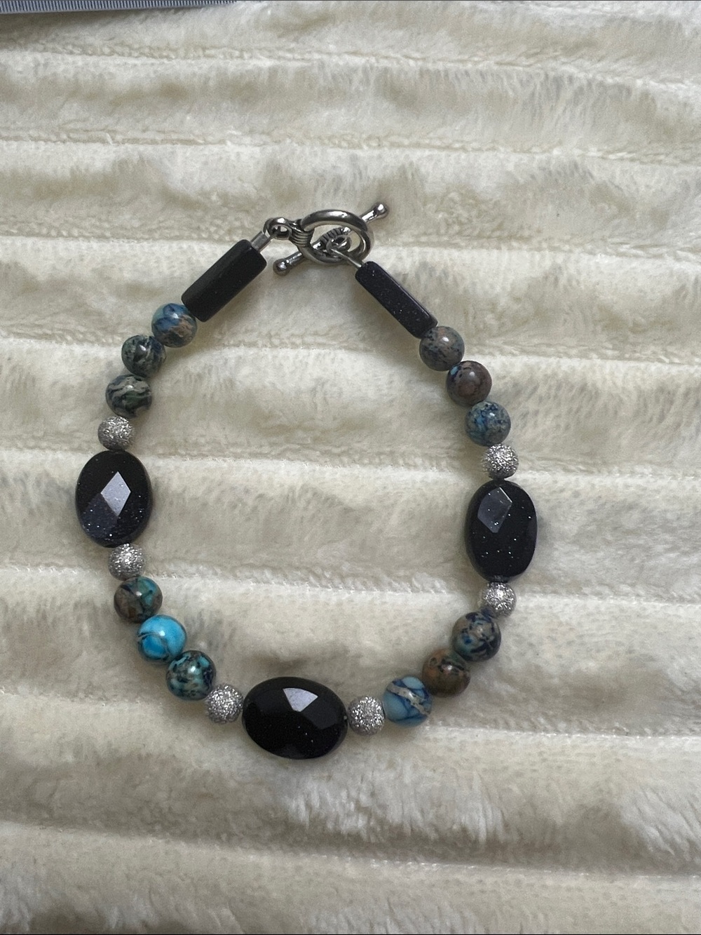 7.25” Blue goldstone & blue jasper Bracelet with silver accent and toggle clasp